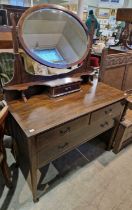 An Edwardian mahogany and checker banded inlaid mirror-back dressing table, the oval bevelled