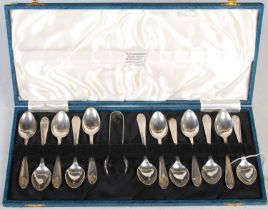 A cased set of twelve Sheffield silver coffee spoons and sugar tongs.