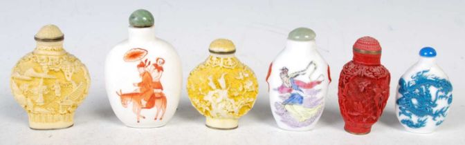 Six assorted Chinese snuff bottles and stoppers, to include a porcelain example decorated in iron