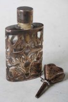 A clear glass and white metal overlaid scent bottle and screw stopper, 6.2cm high, together with