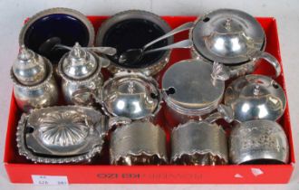 A collection of silver nine assorted silver cruets, two silver napkin rings, four assorted silver