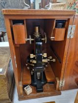 An early 20th century Carl Zeiss Jena brass microscope, No.63460 in mahogany fitted case with