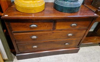 A 19th century stained pine chest of two short over two long graduated drawers, with brass shell cup