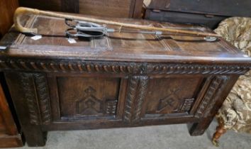 A late 18th/ early 19th century carved oak kist, 70cm high x 133cm wide x 58cm deep.