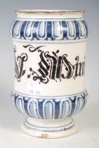 An antique Italian Maiolica Albarello pottery dry drug jar, decorated in manganese and cobalt