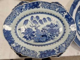 A pair of Chinese blue and white porcelain oval shaped dishes, Qing Dynasty, decorated with