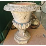 A late 19th century fire clay garden urn, formed in two parts, 52cm high.