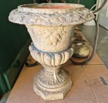 A late 19th century fire clay garden urn, formed in two parts, 52cm high.