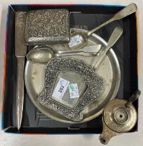 A group of plated items comprising circular dish, three teaspoons, a shaped spoon, an incised
