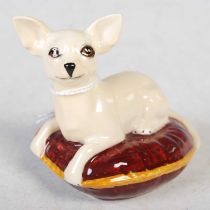 A Beswick model of a Chihuahua lying on a cushion, printed marks, 7cm high.