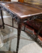 A Chinese dark wood gaming table, Qing Dynasty, the detachable rectangular top with faux bamboo