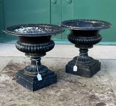 A pair of late 19th/ early 20th century cast metal garden urns, approximately 45cm diameter x 44cm