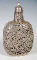 A Persian white metal decanter and cover, pierced with foliate scrolls, the cover attached by two