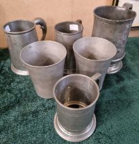 A collection of antique pewter ware to include four tankards, and two tumblers.