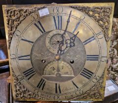 A brass clock dial by Henry Deene of Honiton, the dial with Roman numeral chapter ring and Arabic