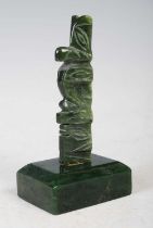 A New Zealand carved pounamu, column 7.8cm high, together with a green stone rectangular cushion