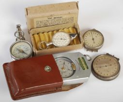 A box of assorted vintage compasses, and a boxed 'Map Measure'.