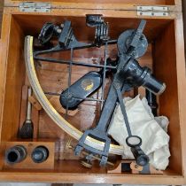 An antique sextant in a fitted wooden case, the case with engraved metal plaque 'W. McKenzie Ayr