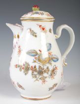 An 18th century Vienna porcelain hot water pot, decorated in under-glaze blue and puce, with scatter