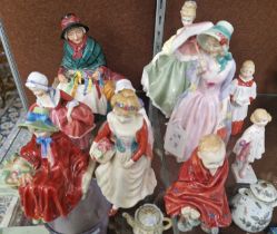 A group of nine Royal Doulton figures to include 'Miss Demure' HN1402; 'Fair Lady' HN2193'; 'Silks