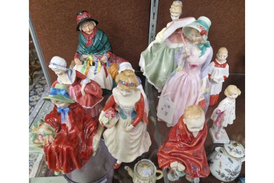 A group of nine Royal Doulton figures to include 'Miss Demure' HN1402; 'Fair Lady' HN2193'; 'Silks - Image 1 of 2