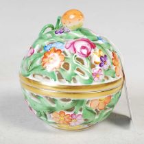 A Herend porcelain circular pierced box and cover, decorated with flowers and foliage, 8cm high.