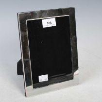 A modern Sheffield silver rectangular shaped photograph frame with strut support, makers mark of '