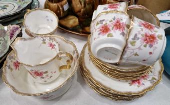 A Clematis part tea set with gilded borders and floral details, pattern No. 9529, registration No.