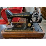 An antique Singer sewing machine, serial number Y6281622.