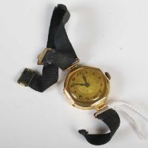 An early 20th century ladies 18ct gold cased octagonal shaped wristwatch with engine turned dial