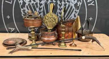 A collection of copper and brassware to include a copper and brass coal scuttle in the form of a