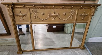 A Regency style gilt framed triple plate overmantle mirror with ball set frieze with urn and swag