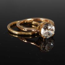 An 18ct gold wedding ring, size R, 2.4 grams, together with a yellow metal paste set solitaire ring,