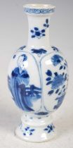 A Chinese porcelain blue and white lobed vase, Qing Dynasty, probably Kangxi, decorated with two