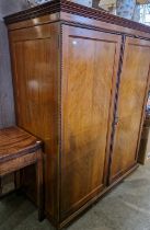 A late 19th century mahogany compactium, the double doors opening to a partially fitted interior,