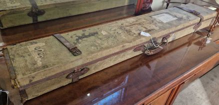 A canvas and leather bound gun case with manufacturer's label 'Joseph Lang & Son Ltd, gun and