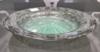 A Monart glass shallow dish, probably shape YE, mottled black and green with gold-coloured