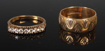 A 9ct gold wedding ring, together with a yellow metal nine stone ring set with a row of round