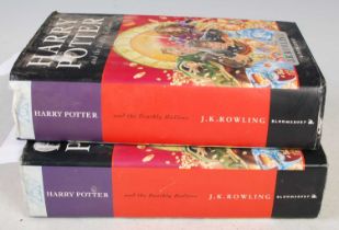 Two volumes of Harry Potter, 'The Deathly Hallows', first editions by JK Rowling, published by