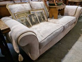 A modern Victorian style off-white two-seat sofa, probably Duresta, the seat cushions covered with