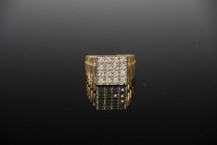 A 9ct gold and diamond set dress ring, set with four uniform rows of four round brilliant cut