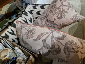 Two boxes containing four good quality cushions and an assortment of lampshades.
