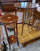 An Edwardian mahogany and inlaid circular two-tier plant stand, raised on four downswept supports,