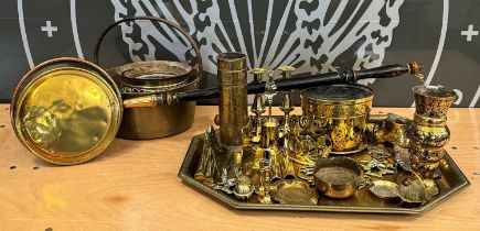 A large collection of assorted brassware to include serving tray, jardinieres, candlesticks, horse