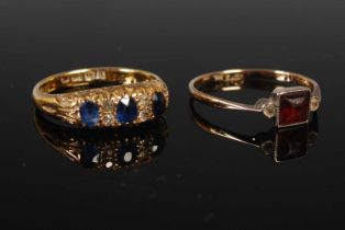 A late 19th / early 20th century 18ct gold sapphire and diamond set dress ring, set with three