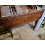 A 19th century mahogany drop-leaf Pembroke table, raised on four turned cylindrical columns with