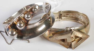 Sigi Tasco, a Mexican silver hinged bangle set with a row of four graduated spheres, 61 grams,