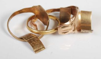 A group of scrap gold to include a cut 18ct gold wedding band, 1.9 grams, a cut 9ct gold signet