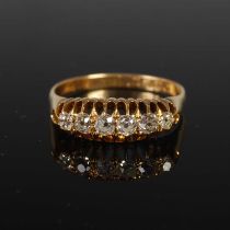 An 18ct gold and diamond six stone ring, size S, gross weight 4 grams.