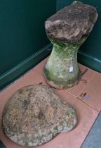A garden standing stone with shaped removable top.